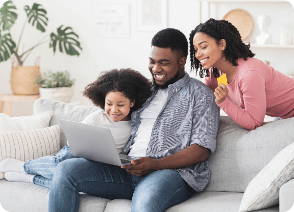 Happy family using laptop together