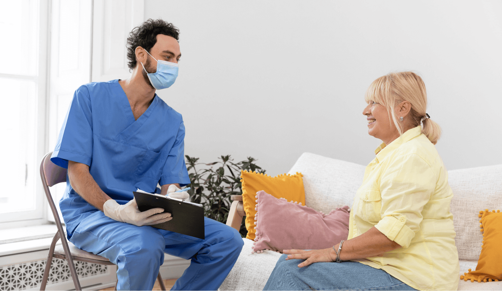 Home nursing care professional with patient